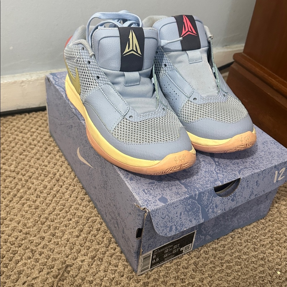 Light Blue Sneakers with Colorful Sole